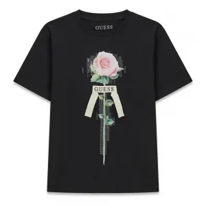 Детска памучна тениска Guess с нежна роза и 3D панделка в класически черен цвят